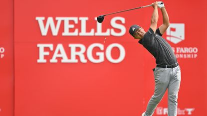 Xander Schauffele hits a drive on the 14th tee box during the final round of the Wells Fargo Championship at Quail Hollow Club
