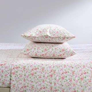 Laura Ashley Cotton Percale Bed Sheets against a gray background.