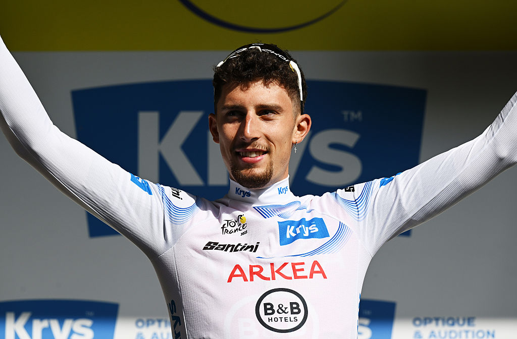 Arkea-B&B Hotels team's French rider Kevin Vauquelin celebrates on the podium with the best young rider's white jersey after the 3rd stage of the 112th edition of the Tour de France cycling race, 178.3 km between Valenciennes and Dunkerque (Dunkirk), Northern France, on July 7, 2025. (Photo by Marco BERTORELLO / AFP) (Photo by MARCO BERTORELLO/AFP via Getty Images)