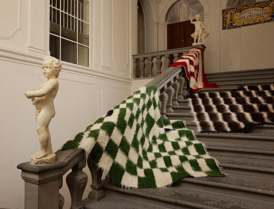 Grace Atkinson throws photographed on a stone staircase