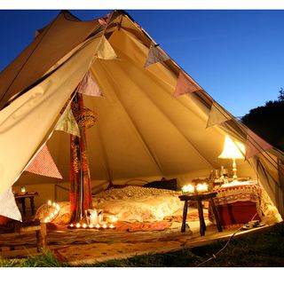 tent at evening with lamps and lights