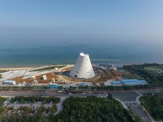 Open Architecture's Sun Tower from the air within the Yantai waterfront former industrial complex