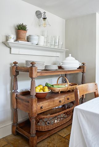 vintage sideboard in a white cottage kitchen