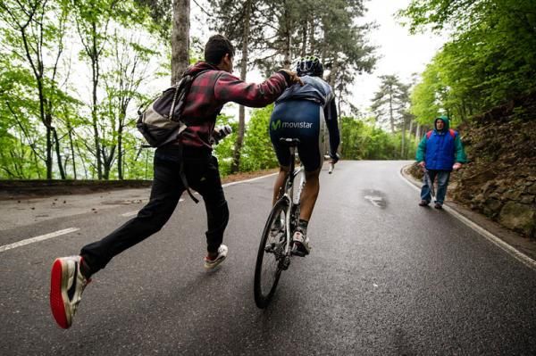 A Movistar rider accepts some gentle help