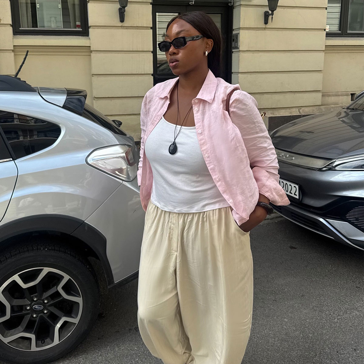 @nnennaechem outfit picture pink shirt white tank and yellow pants