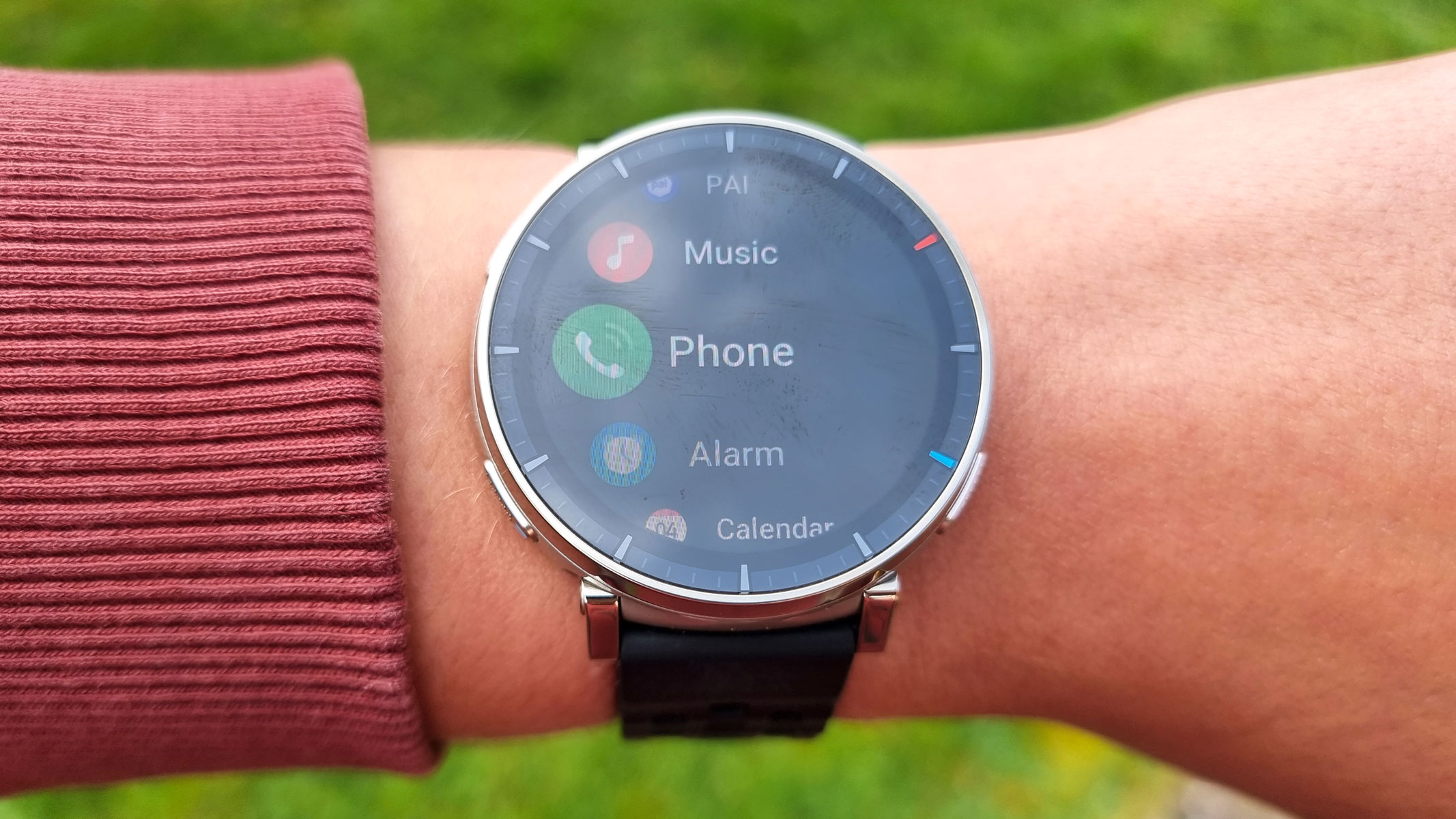 a close-up picture of our reviewer wearing the Amazfit Active 3 Premium smartwatch