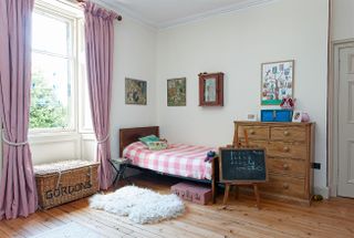 Children's room with bed in georgian home