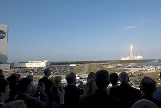 Shuttle Discovery lifts off on Feb. 24, 2011 on its final mission STS-133. This photo was taken from the VIP viewing area at KSC.