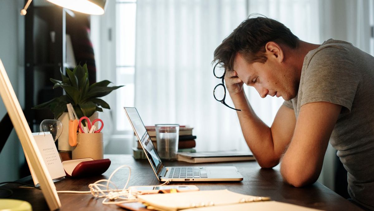 Man stressed at computer