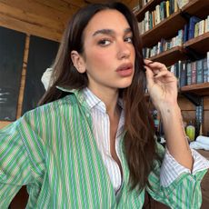 Dua Lipa wearing two button-down shirts