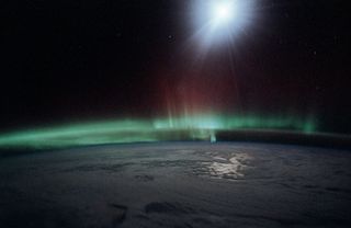 Solar wind particles generate the aurora phenomena in the Earth’s atmosphere. 