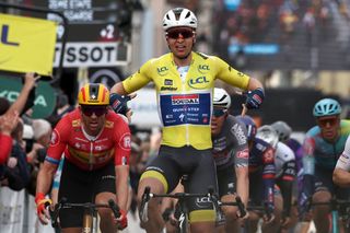 Paris-NIce 2025: Tim Merlier (Soudal-QuickStep) carries the overall leader's yellow jersey across the finish line for victory on stage 2 in Bellegarde