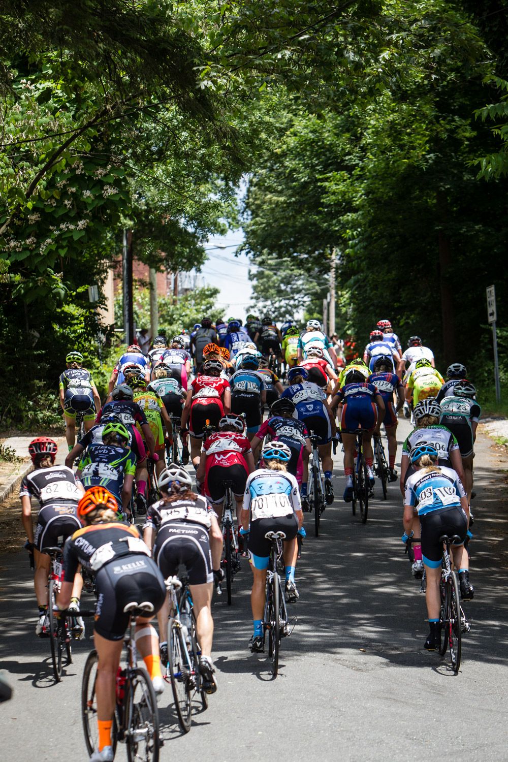 The womens field works its way up the steep climb.