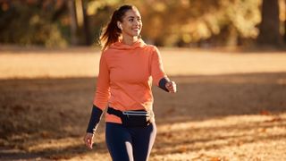 a woman walking in a park