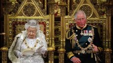 LONDON, UNITED KINGDOM - OCTOBER 14: Britain's Queen Elizabeth II (L) reads the Queen's Speech on the The Sovereign's Throne in the House of Lords next to Prince Charles, Prince of Wales (R) during the State Opening of Parliament in the Houses of Parliament on October 14, 2019 in London, England. The Queen's speech is expected to announce plans to end the free movement of EU citizens to the UK after Brexit, new laws on crime, health and the environment.