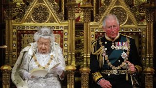 LONDON, UNITED KINGDOM - OCTOBER 14: Britain's Queen Elizabeth II (L) reads the Queen's Speech on the The Sovereign's Throne in the House of Lords next to Prince Charles, Prince of Wales (R) during the State Opening of Parliament in the Houses of Parliament on October 14, 2019 in London, England. The Queen's speech is expected to announce plans to end the free movement of EU citizens to the UK after Brexit, new laws on crime, health and the environment.