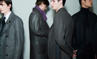 Male models wearing grey and black coats from Hermes AW15 collection