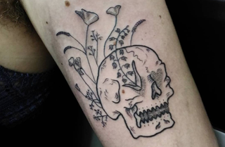 Delicate skull tattoo