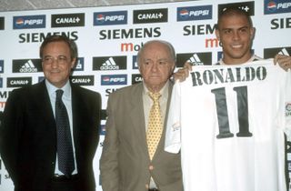 Ronaldo poses with a Real Madrid shirt alongside Alfredo Di Stefano and Florentino Perez after signing from Inter in 2002.