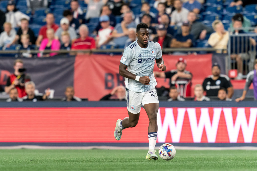 Jhon Duran #26 of Chicago Fire FC brings the ball forward during a game between Chicago Fire FC and New England Revolution at Gillette Stadium on August 31, 2022 in Foxborough, Massachusetts.