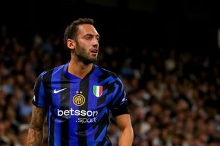 Hakan Calhanoglu of FC Internazionale Milano looks on during the UEFA Champions League 2024/25 League Phase MD1 match between Manchester City and FC Internazionale Milano at Etihad Stadium on September 18, 2024 in Manchester, England.