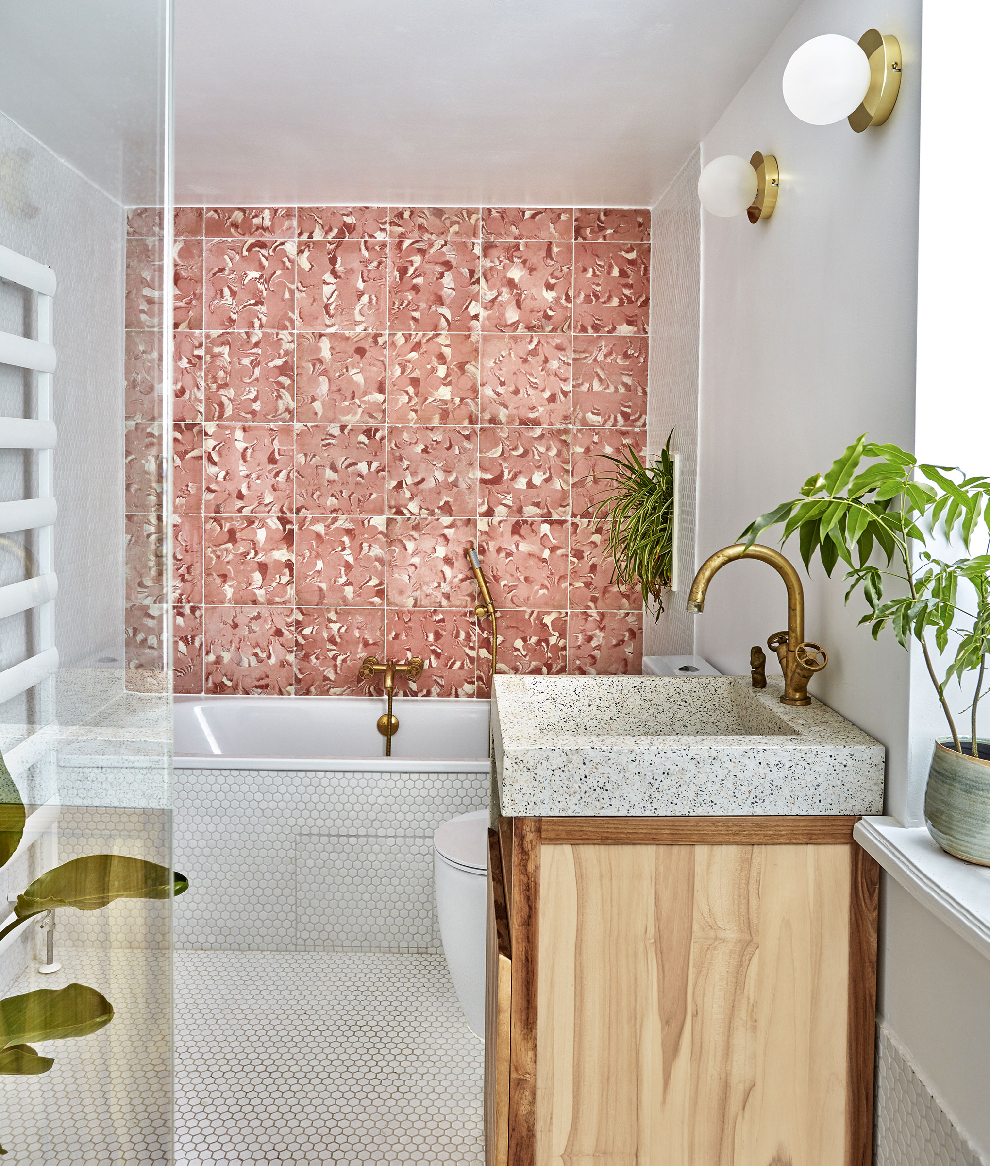 bathroom with pink mosaic wall tiles