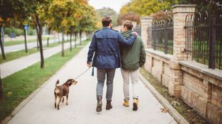 Gay couple walking dog