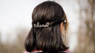 woman wearing a chanel hair clip