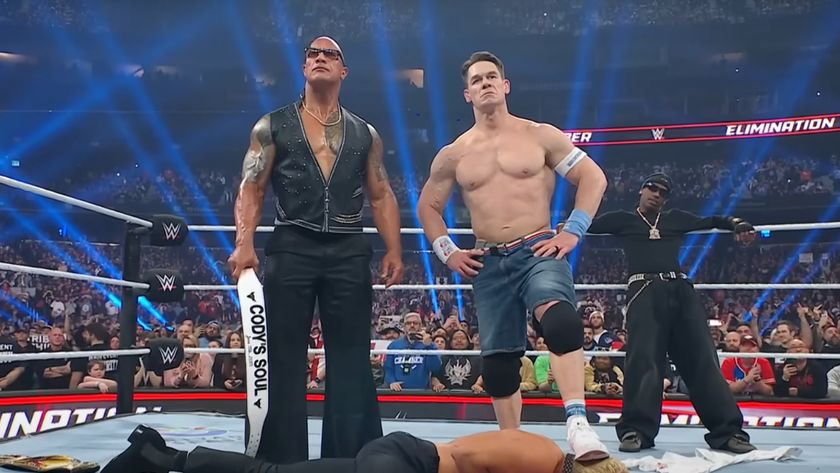 The Rock, John Cena, and Travis Scott stand over Cody Rhodes at Elimination Chamber 2025