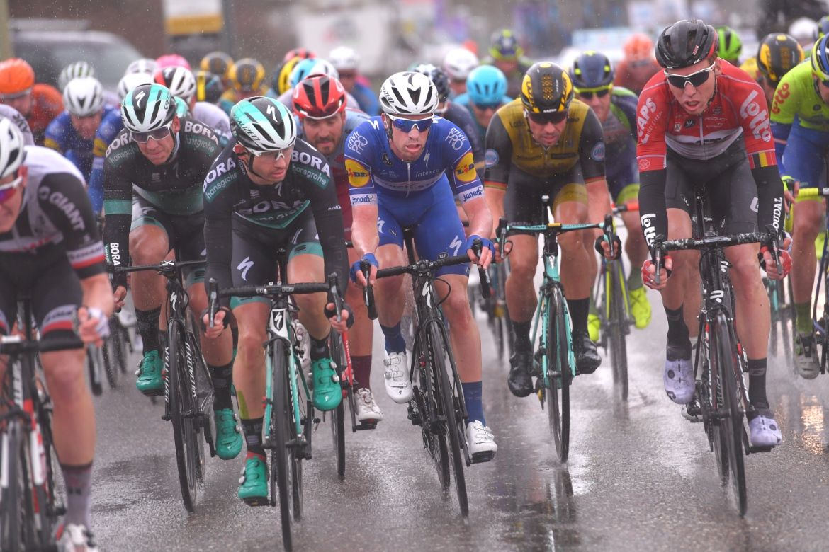 Rain punished the peloton on the final laps