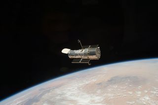 The Hubble Space Telescope got one last overhaul in May 2009 by NASA astronauts on the space shuttle Atlantis and has been sending home stunning new photos ever since. Seen here, the iconic space telescope orbits high above the Earth, after it was released at the close of the STS-125 servicing mission to once more gaze deep into the universe.