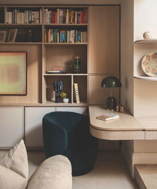 home office with bespoke wooden shelving and curved floating desk