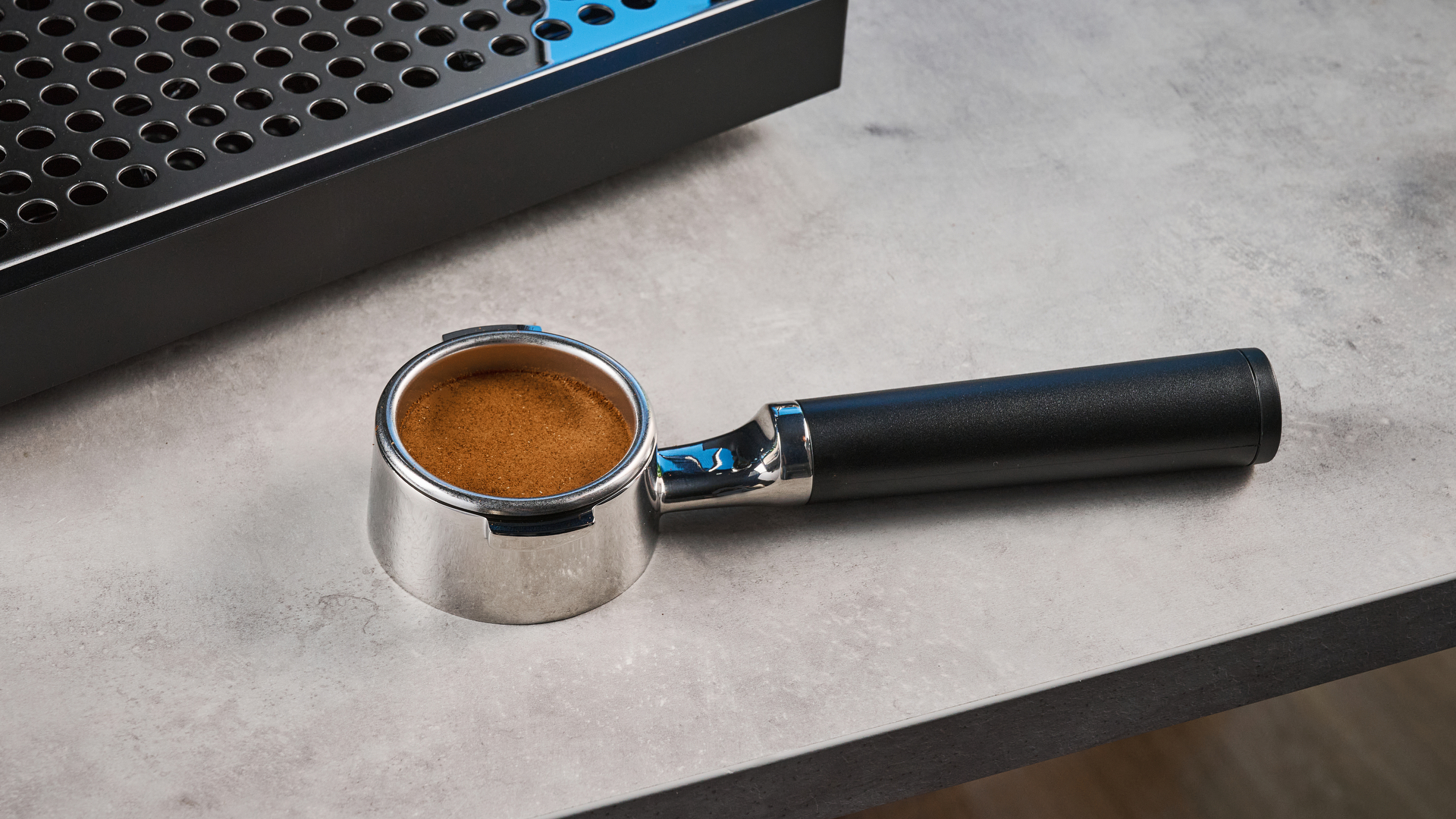 the fellow espresso series 1 photographed against a blue tom's guide background showing espresso, LCD smart screen, steam wand
