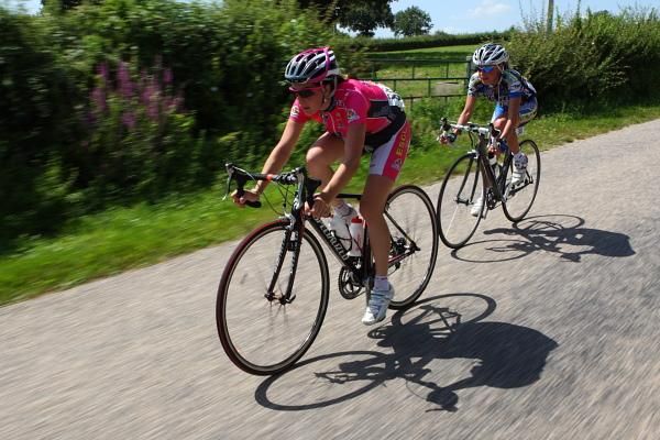 Evelyn Stevens (USA) grits her teeth after her attack and solo escape in the final 30km