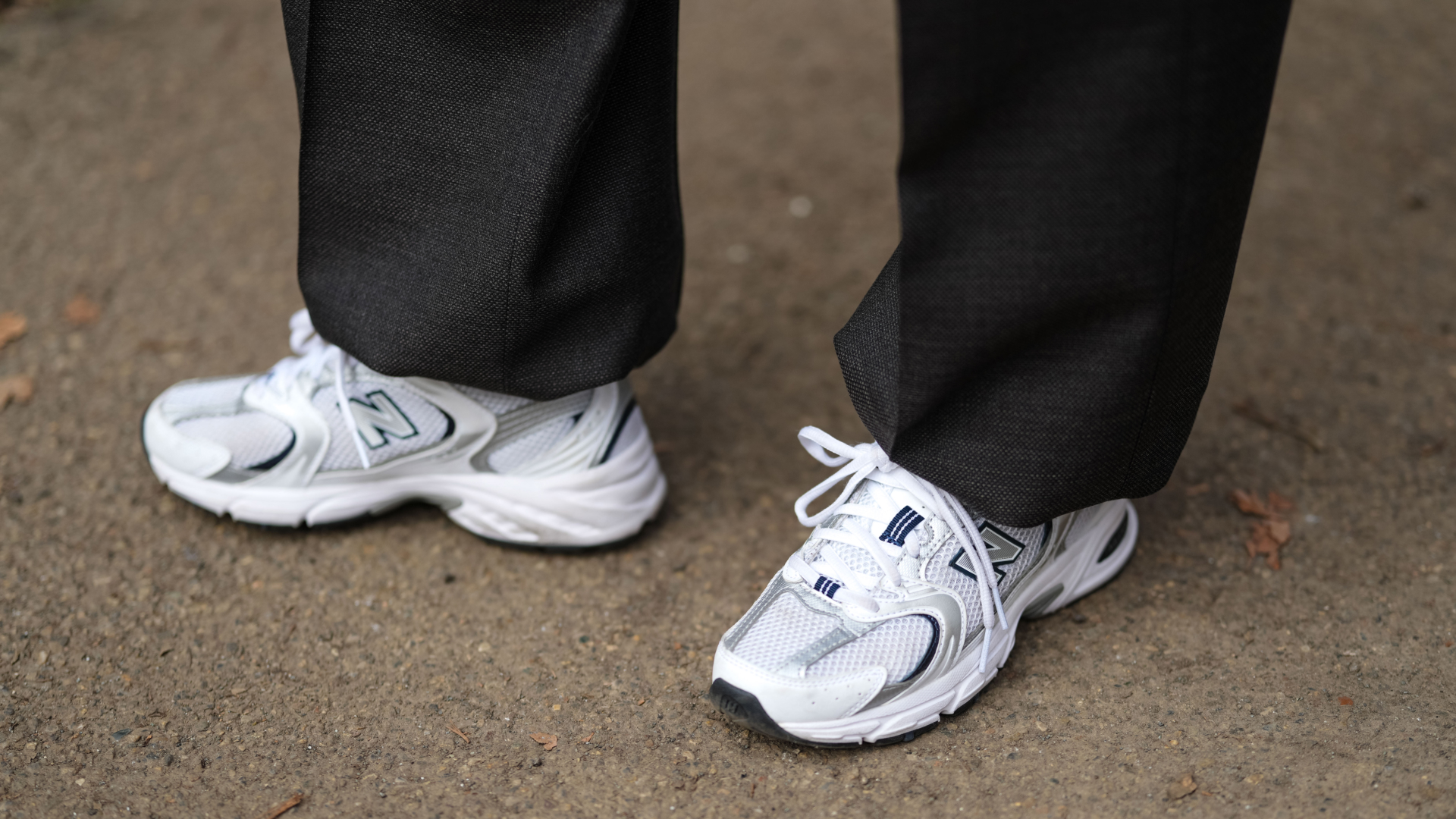 A guest wears New Balance sneakers shoes , outside Dolce &amp; Gabbana, during the Milan Fashion Week Menswear Fall/Winter 2025-2026 on January 18, 2025 in Milan, Italy.