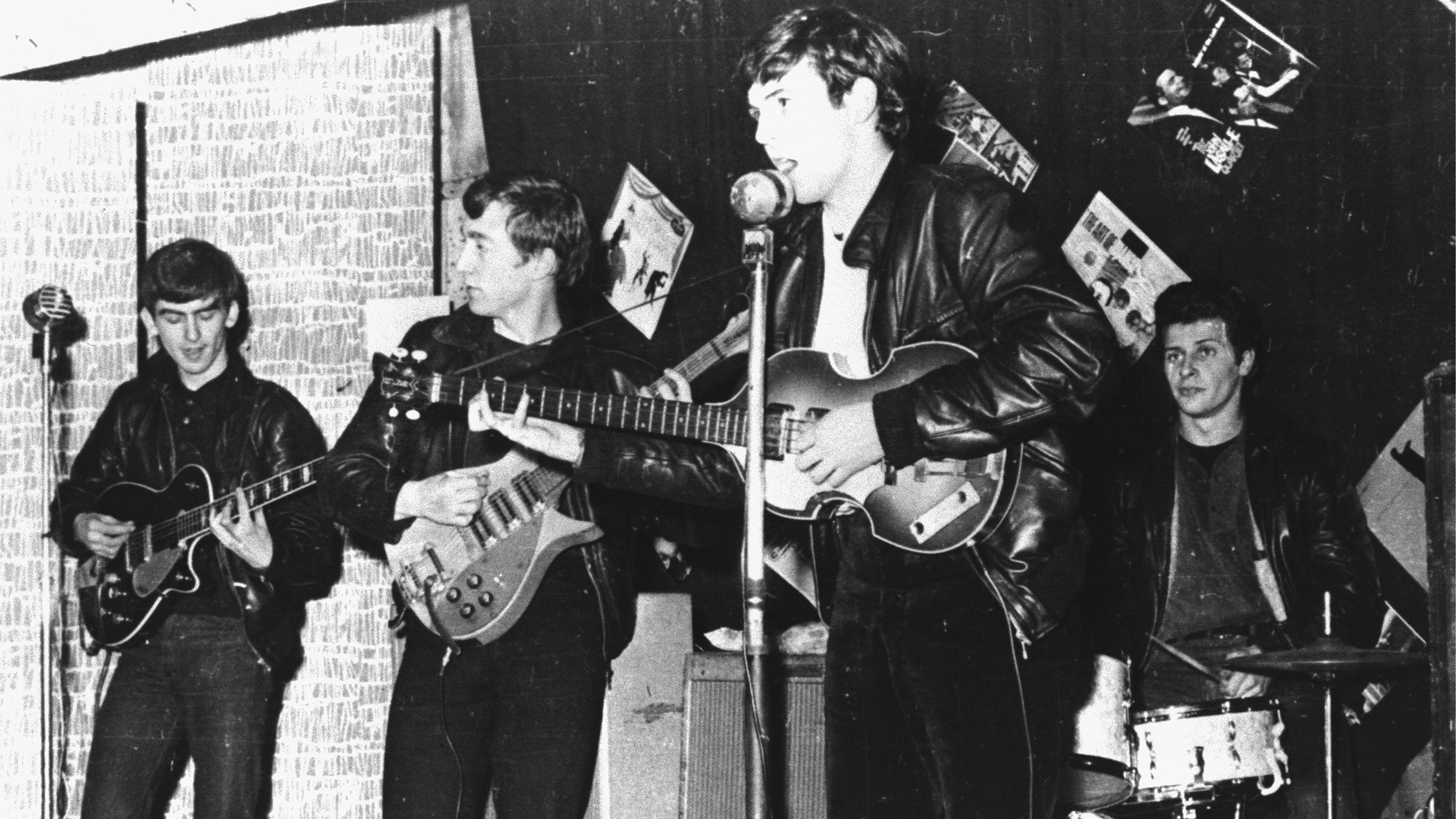 British rock group The Beatles perform in a club prior to signing their first recording contract, Liverpool, England, 1962. L-R: George Harrison, John Lennon, Paul McCartney, and original drummer Pete Best.
