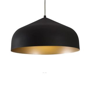 A black pendant light with gold interior