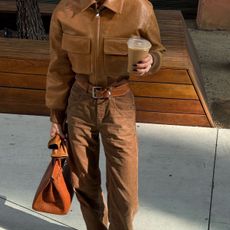 @hoskelsa holding a Hermes handbag and a coffee