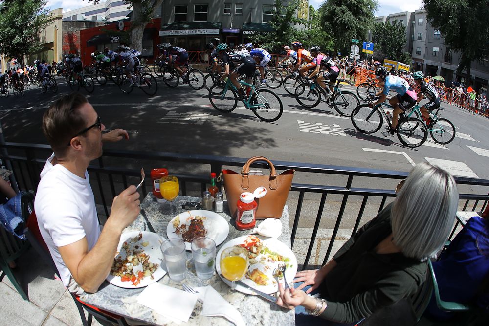Diners have a front-row seat to watch the final stage at the Tour of California.