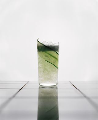 cocktail with cucumber garnish