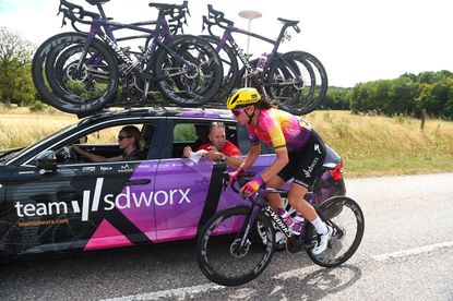Chantal van den Broek-Blaak (SDWorx) receives treatment from her team after crashing on stage five of the 2022 Tour de France Femmes