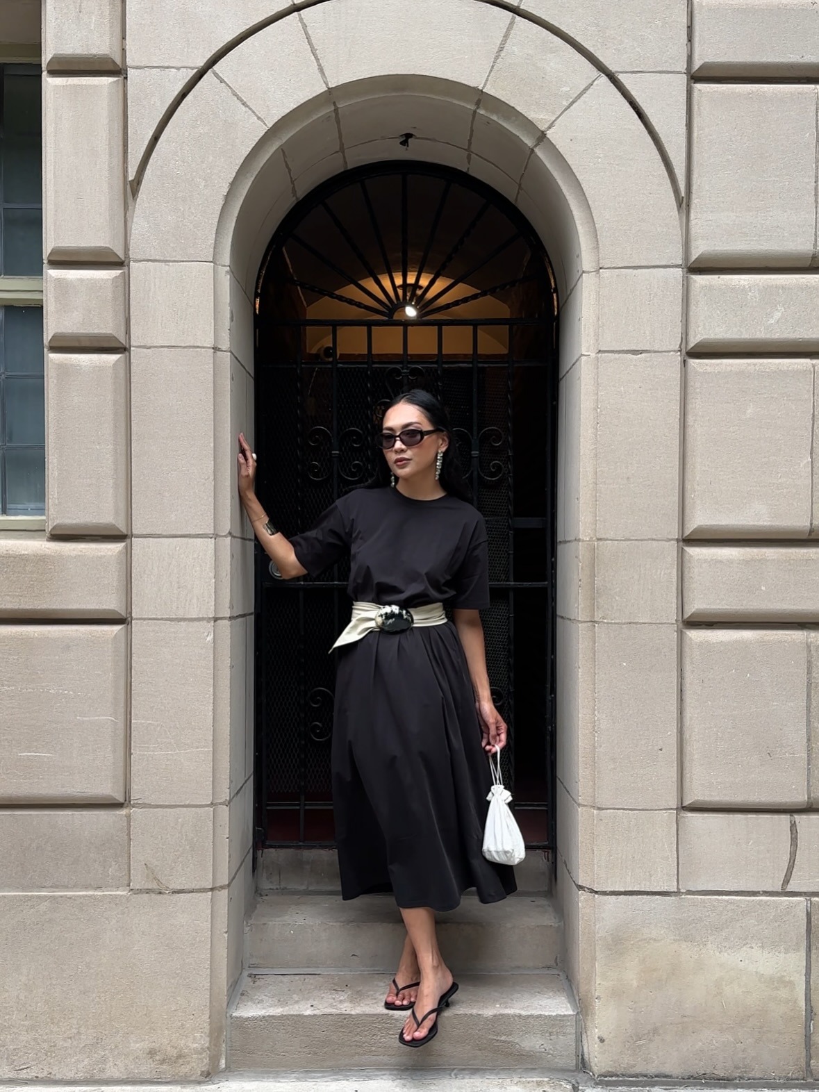 Woman wearing colorful handbag, a 2026 trend.