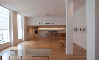 An open plan habitat showroom with the words "PLATFORM habitat" displayed on a wall.