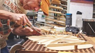 Acoustic guitar being built in a workshop