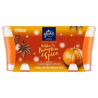 Orange packacing showing two glass candle holders with orange wax inside and orange font on a label that says Glade Candle, Infused With Essential Oils, Golden Pumpkin & Spice, 2 Count