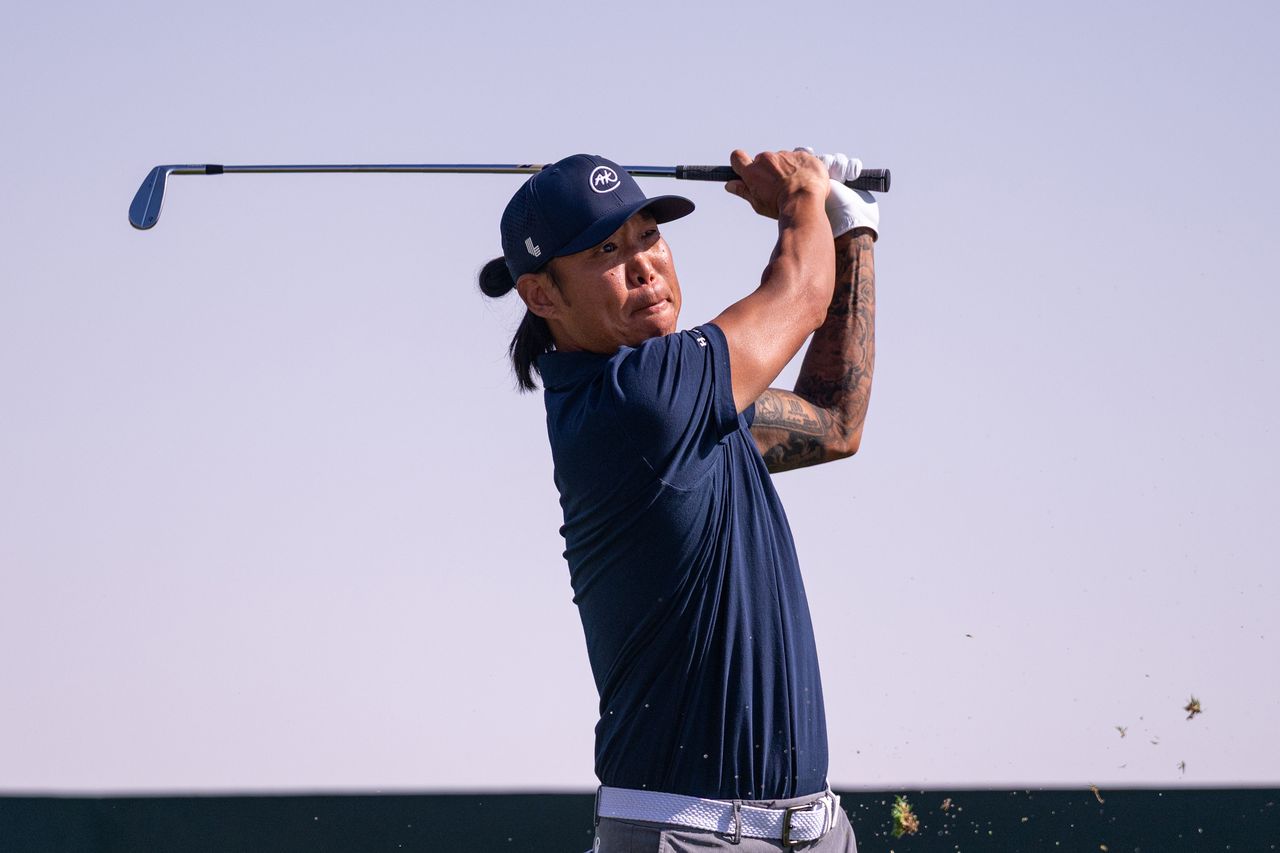 Anthony Kim hits an iron shot