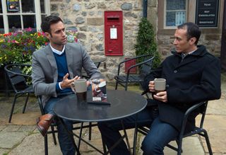 Nikhil and Jai Sharma have a coffee together.