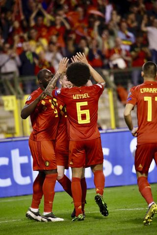 Belgium celebrate Kevin De Bruyne's third goal against Scotland