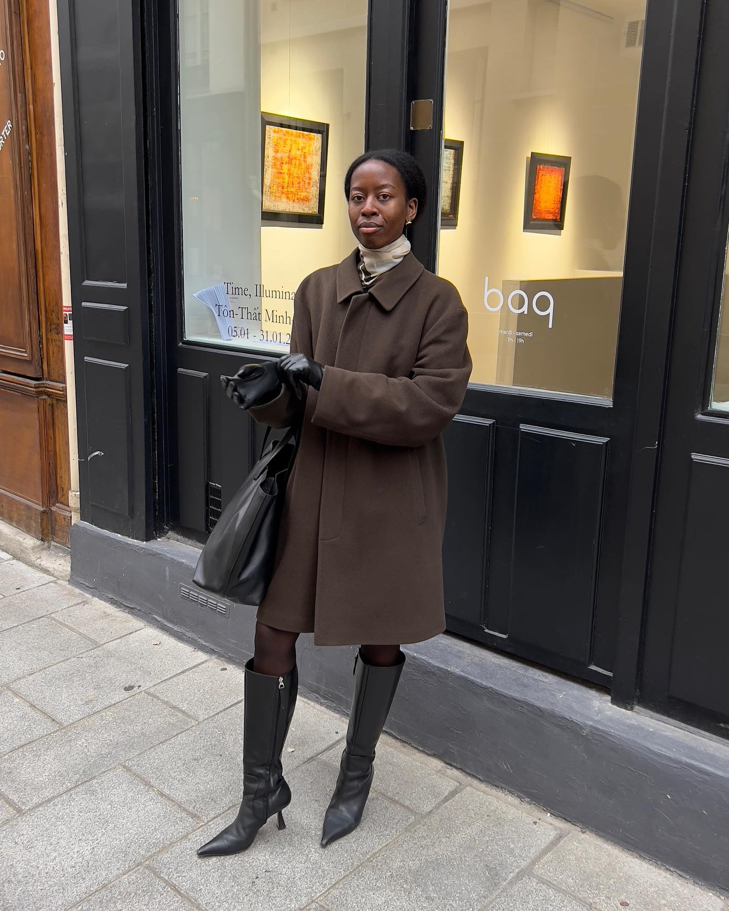 An image of @sylviemus_ with a scarf neck tie, one of the most stylish ways to wear a scarf in 2025.