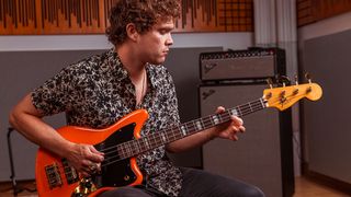 Royal Blood frontman Mike Kerr poses with his Fender Jaguar Bass